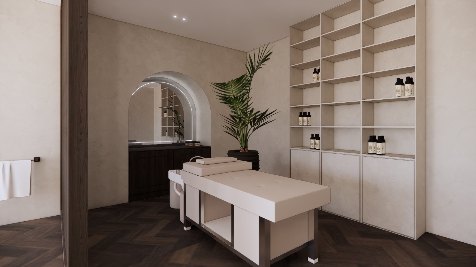 Treatment room with massage table and open shelving wall